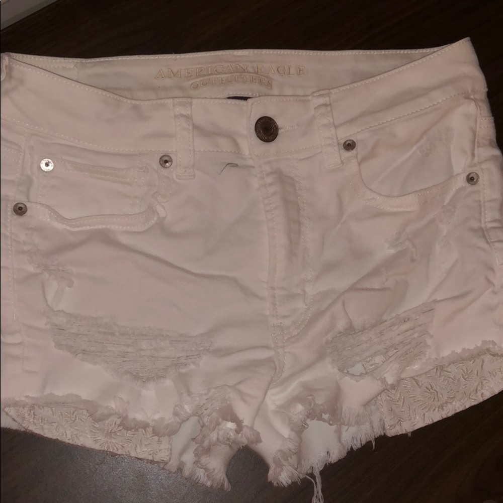 white ripped jean shorts